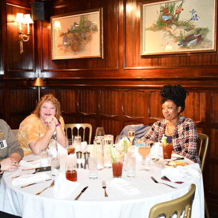 a group of people sitting at a table