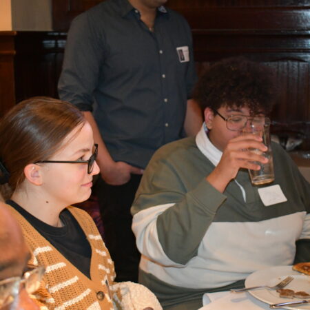 a group of people sitting at a table