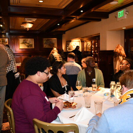 a group of people sitting at a table