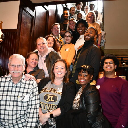 a group of people posing for a photo