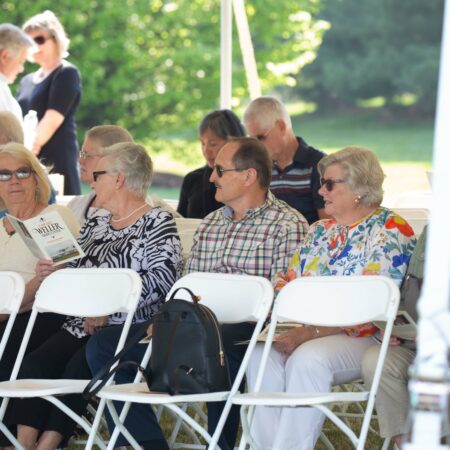 a group of people sitting in chairs