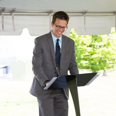 a person standing at a podium