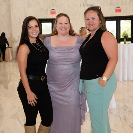 a group of women posing for a photo
