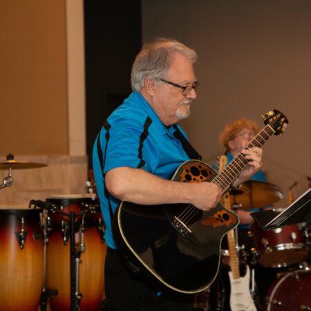 a person playing a guitar