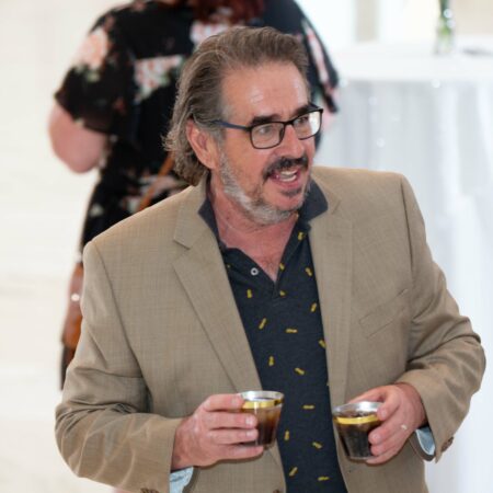 a person holding a drink