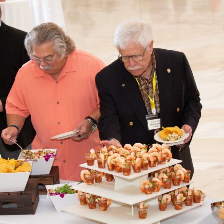 a group of men serving food