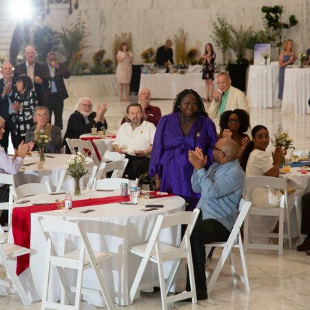a group of people sitting at tables