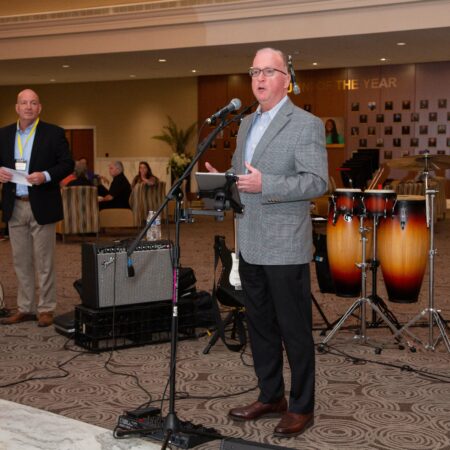 a person standing in front of a microphone