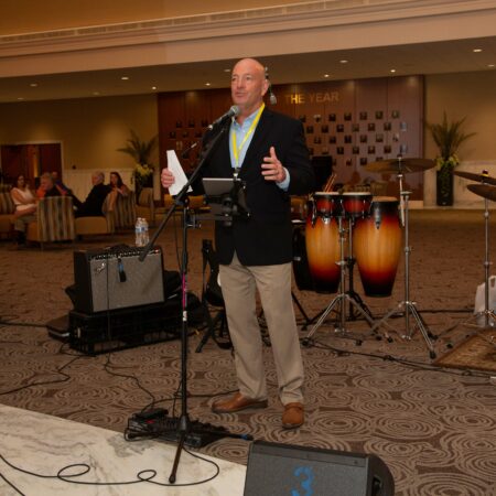 a person standing in front of a microphone