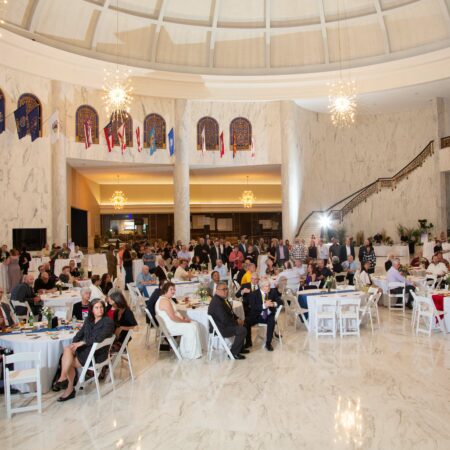 a group of people sitting at tables in a room