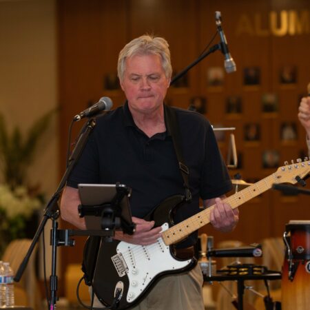 a person playing a guitar