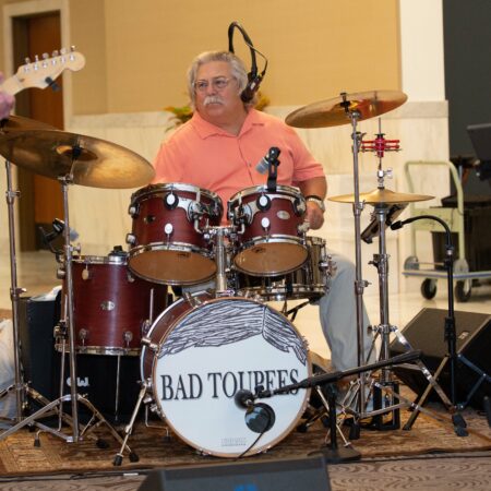 a person playing a drum set