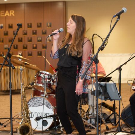 a person singing into a microphone