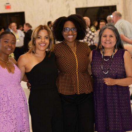 a group of women posing for a photo