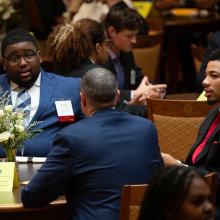 a group of people sitting at a table