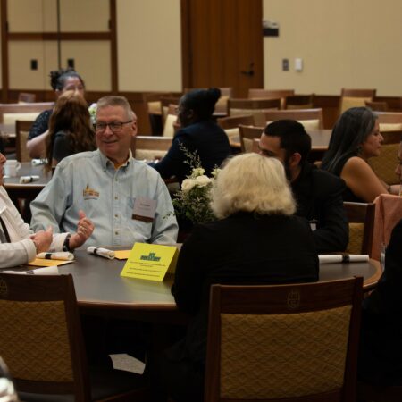 a group of people sitting at a table