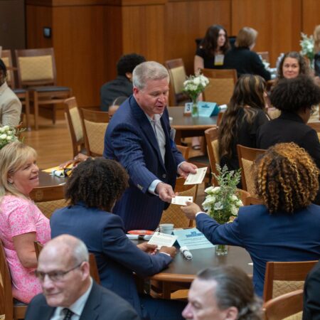 a group of people sitting around tables