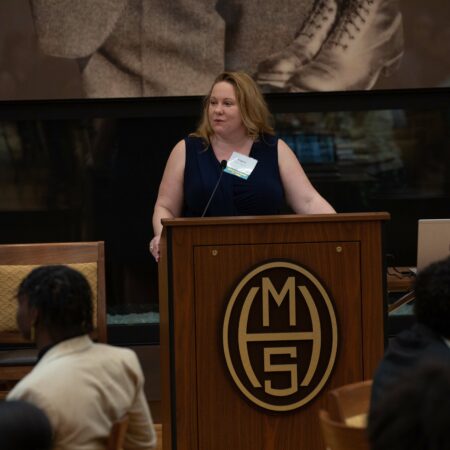 a person standing at a podium