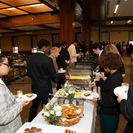 a group of people at a buffet