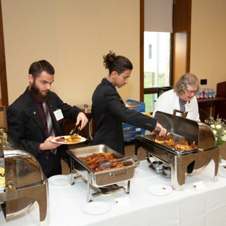 a group of people serving food