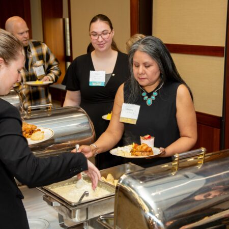 a group of women serving food