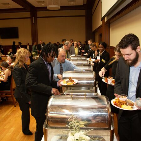 a group of people at a buffet