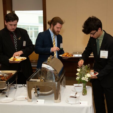 a group of men serving food