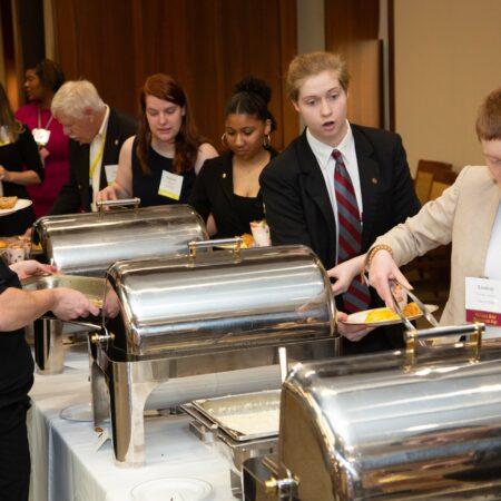 a group of people at a buffet