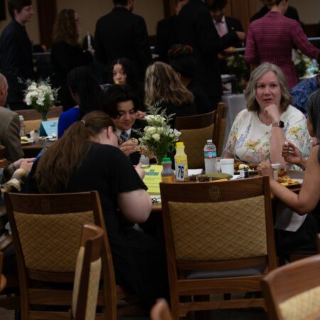 a group of people sitting at a table