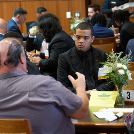 a group of people sitting at a table