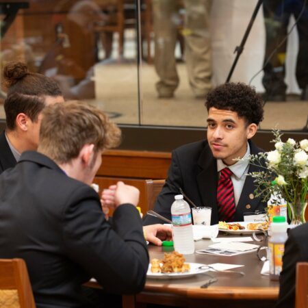 a group of people sitting at a table