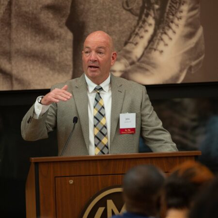 a person standing at a podium