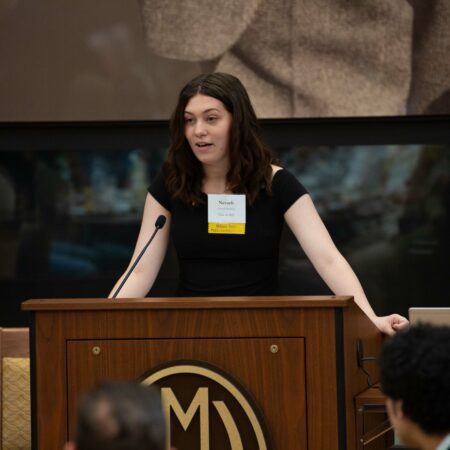 a person standing at a podium