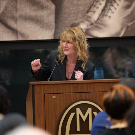 a person standing at a podium