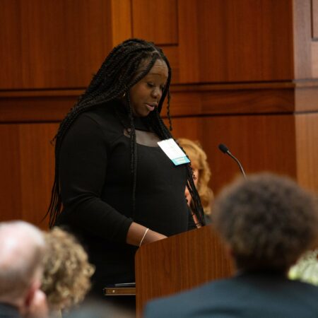 a person standing at a podium