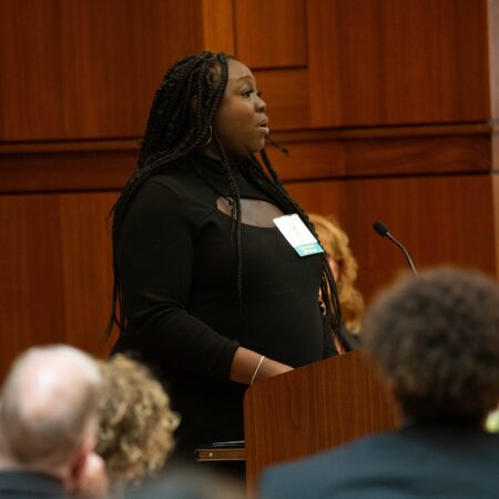 a person standing at a podium