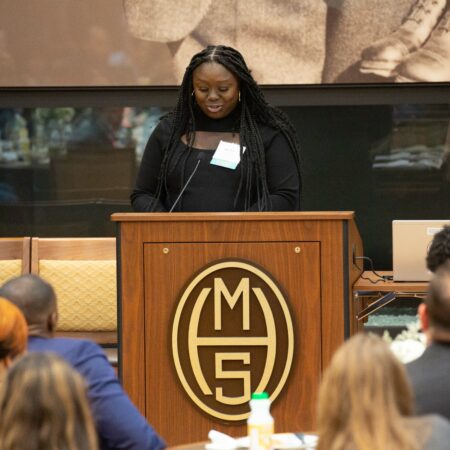 a person standing at a podium