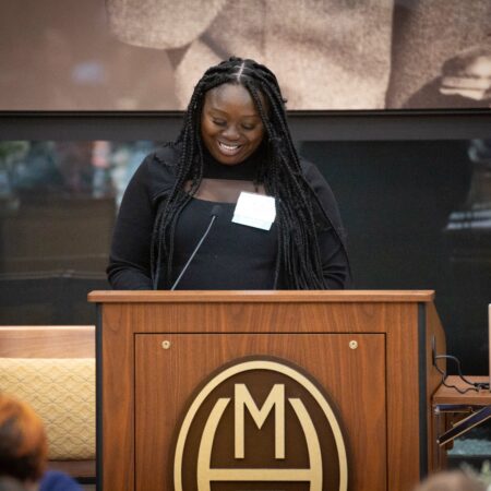 a person standing at a podium