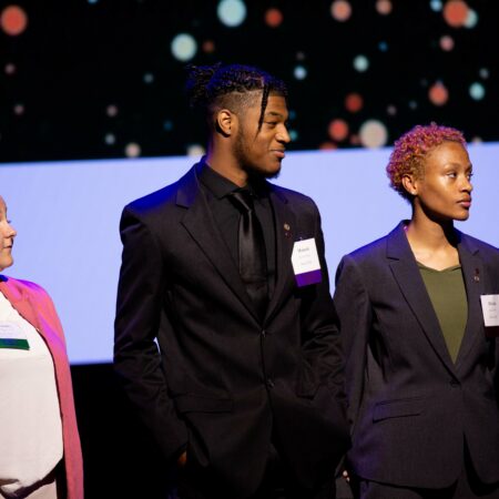 a group of people standing on a stage