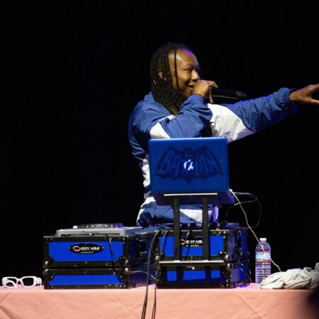 a person with a microphone on a table