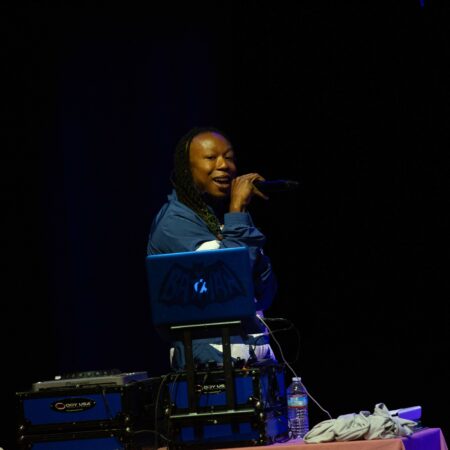 a person singing into a microphone