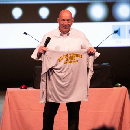 a person holding a shirt