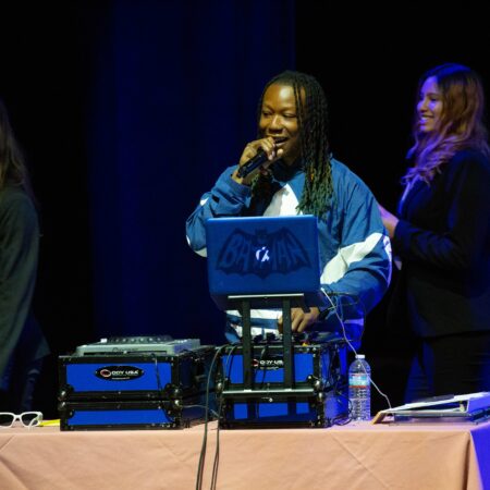 a person singing into a microphone