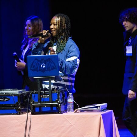 a person speaking into a microphone