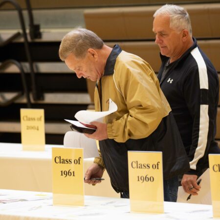 a few men looking at papers