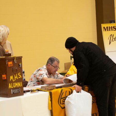 a person looking at a person at a table