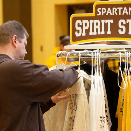 a person looking at a shirt