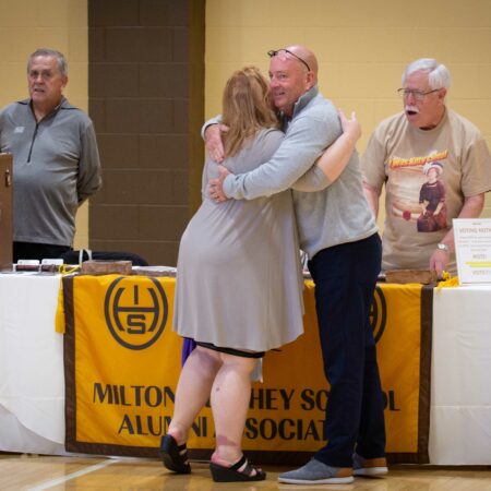 people hugging in a room