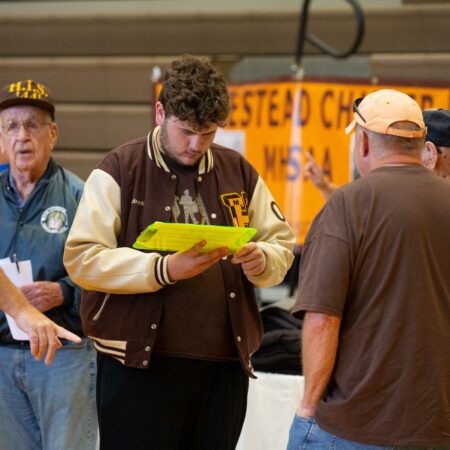 a person looking at a yellow paper