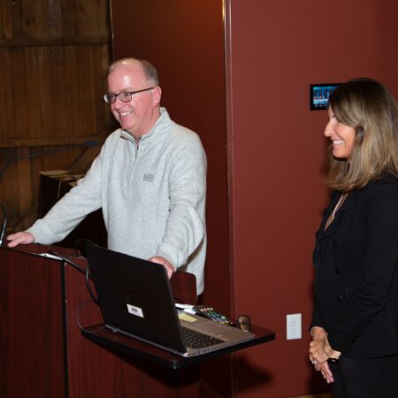 people standing at a podium